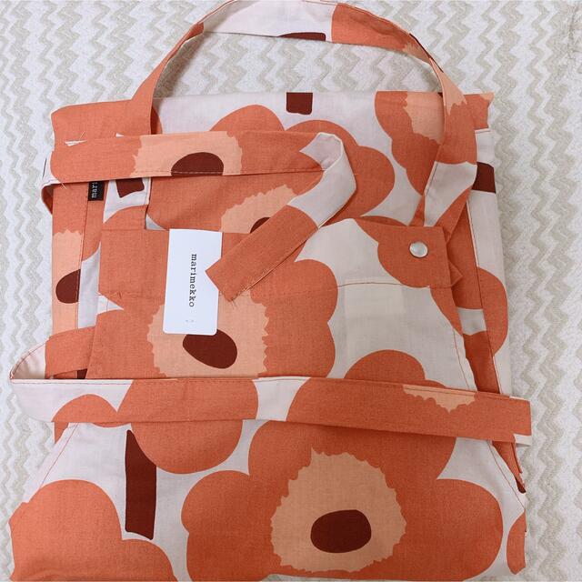 marimekko(マリメッコ)の新品タグ付✨マリメッコ西野七瀬さん着用アプリコット色🍊ピエニウニッコ エプロン レディースのファッション小物(その他)の商品写真