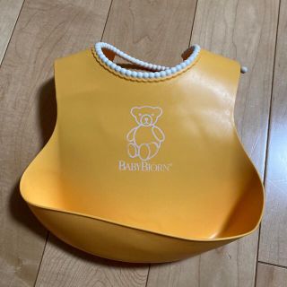 ベビービョルン(BABYBJORN)のBABY BJORN ベビービョルン お食事エプロン スタイ　イエロー(お食事エプロン)