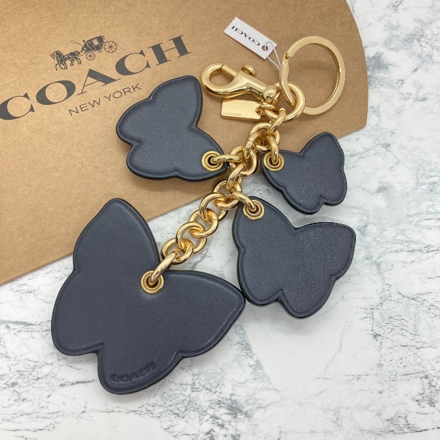 COACH(コーチ)の【COACH】バタフライ クラスター バッグ チャーム デニム マルチ レディースのファッション小物(キーホルダー)の商品写真