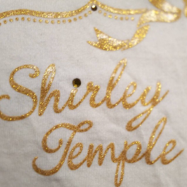 Shirley Temple(シャーリーテンプル)のシャーリーテンプル半袖カットソー100cmリボン白ベージュ金刺繍ラメ女の子キッズ キッズ/ベビー/マタニティのキッズ服女の子用(90cm~)(Tシャツ/カットソー)の商品写真