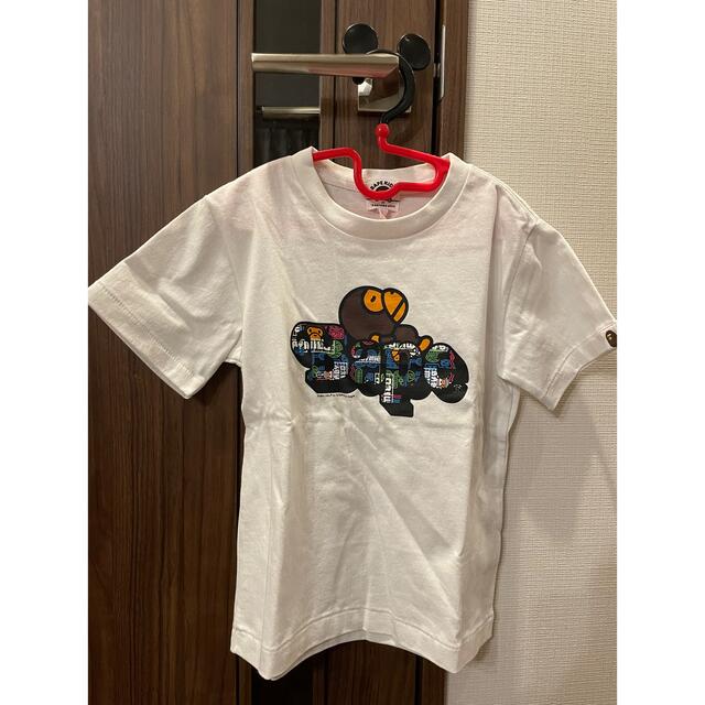 A BATHING APE(アベイシングエイプ)のBAPE KIDS MILO 横になるmiloTシャツ　サンプル品　白120cm キッズ/ベビー/マタニティのキッズ服男の子用(90cm~)(Tシャツ/カットソー)の商品写真