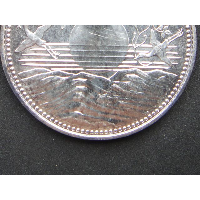 天皇陛下御在位60年記念1万円銀貨