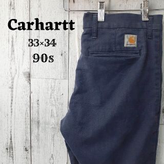 カーハート(carhartt)の希少90sカーハート33×34ワークチノパンスラックス革ロゴ古着ネイビー(チノパン)