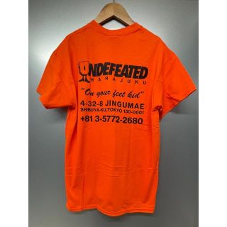 アンディフィーテッド(UNDEFEATED)のUNDEFEATED  リージョンTシャツHARAJUKU【Mサイズ/オレンジ】(Tシャツ/カットソー(半袖/袖なし))