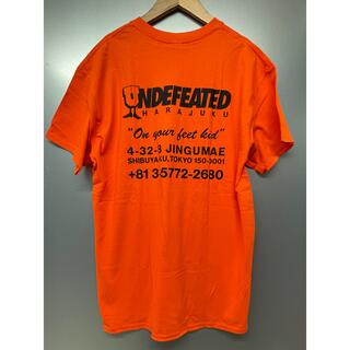 アンディフィーテッド(UNDEFEATED)のUNDEFEATED  リージョンTシャツHARAJUKU【Lサイズ/オレンジ】(Tシャツ/カットソー(半袖/袖なし))