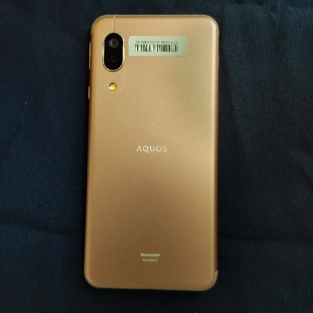 AQUOS(アクオス)のSHARP 国内版SIMフリー SH-RM12 ライトカッパー スマホ/家電/カメラのスマートフォン/携帯電話(スマートフォン本体)の商品写真