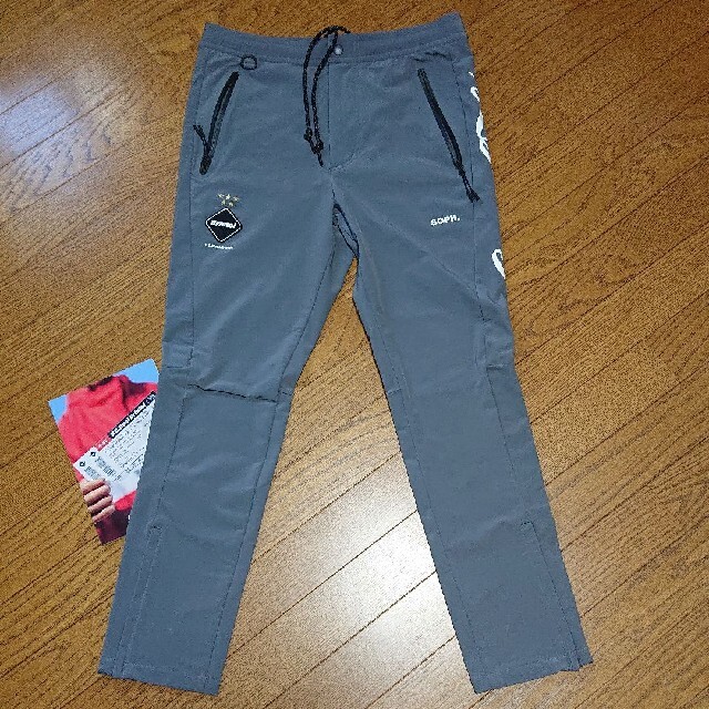 F.C.R.B.(エフシーアールビー)のF.C.R.B Coca-cola WARM UP PANTS (グレー:M) メンズのパンツ(その他)の商品写真