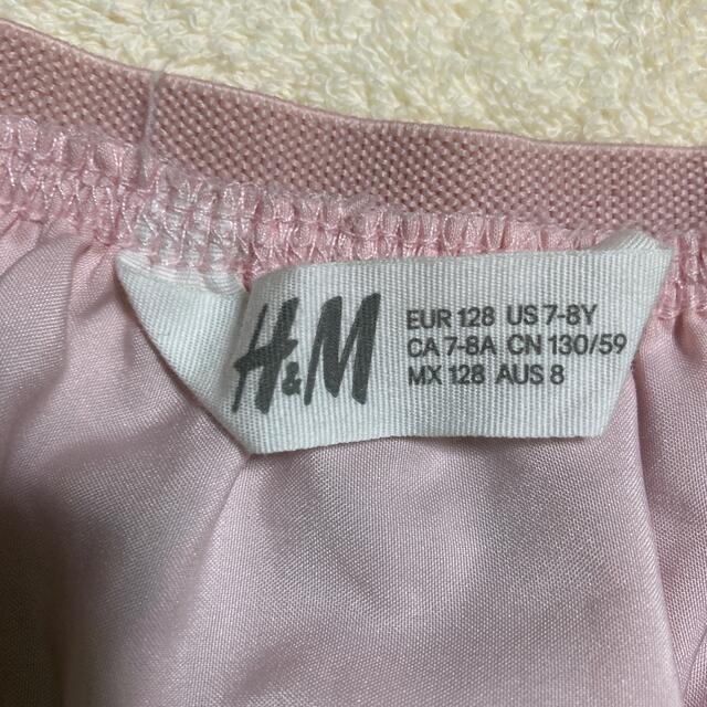 H&M(エイチアンドエム)のH&M スパンコールスカート　130センチ　ハロウィン キッズ/ベビー/マタニティのキッズ服女の子用(90cm~)(スカート)の商品写真