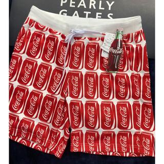 パーリーゲイツ(PEARLY GATES)の新品 ジャックバニー コカ・コーラ アルミ缶柄 ショートパンツ(5)サイズL/赤(ウエア)