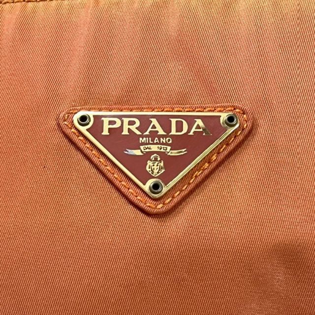 PRADA(プラダ)の【希少】プラダ ハンドバッグ メタルハンドル 三角プレート オレンジ ナイロン レディースのバッグ(ハンドバッグ)の商品写真