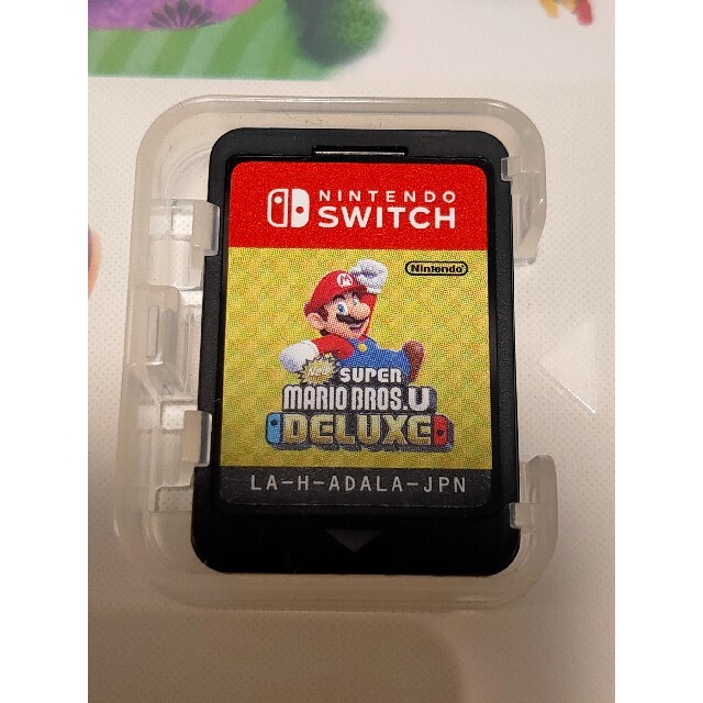 [中古]New スーパーマリオブラザーズ U デラックス Switch エンタメ/ホビーのゲームソフト/ゲーム機本体(家庭用ゲームソフト)の商品写真