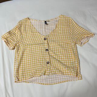 エイチアンドエム(H&M)のH&M 黄色チェックミニ丈トップス(Tシャツ(半袖/袖なし))