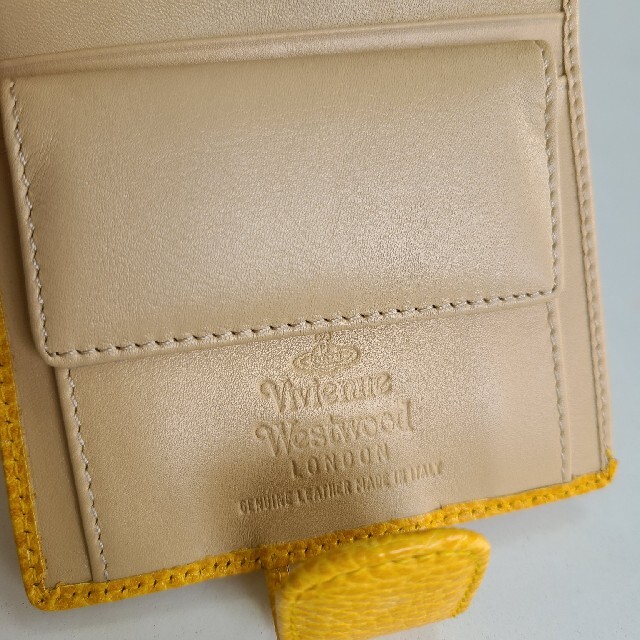 Vivienne Westwood(ヴィヴィアンウエストウッド)の新品未使用ヴィヴィアンウエストウッド折り財布　イエロー×オレンジ レディースのファッション小物(財布)の商品写真