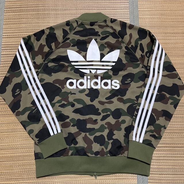 A BATHING APE(アベイシングエイプ)のAPE BAPE KAWS adidas camo 迷彩　m トラックジャケット メンズのトップス(ジャージ)の商品写真