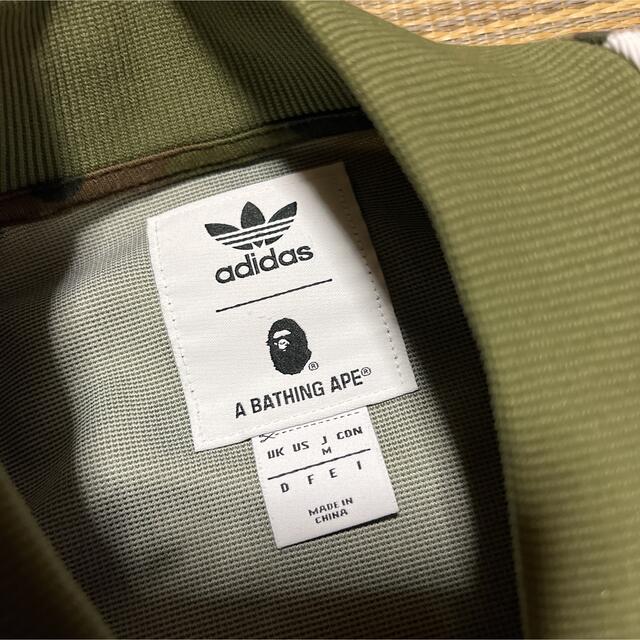 A BATHING APE(アベイシングエイプ)のAPE BAPE KAWS adidas camo 迷彩　m トラックジャケット メンズのトップス(ジャージ)の商品写真