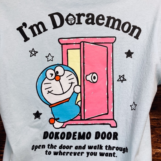 サンリオ(サンリオ)のドラえもん Tシャツ Mサイズ どこでもドア バックプリント 水色 メンズのトップス(Tシャツ/カットソー(半袖/袖なし))の商品写真