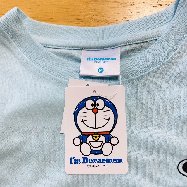 サンリオ(サンリオ)のドラえもん Tシャツ Mサイズ どこでもドア バックプリント 水色 メンズのトップス(Tシャツ/カットソー(半袖/袖なし))の商品写真