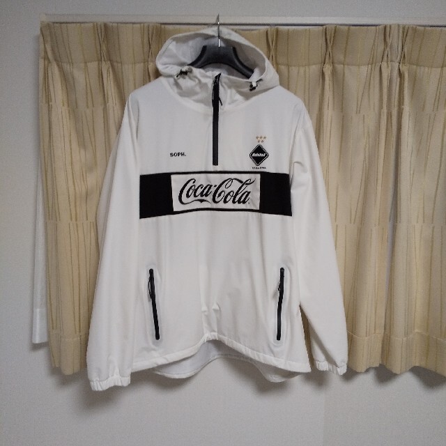 F.C.R.B.(エフシーアールビー)の20ss fcrb「COCA-COLA HALF ZIP ANORAK」ホワイト メンズのジャケット/アウター(ナイロンジャケット)の商品写真