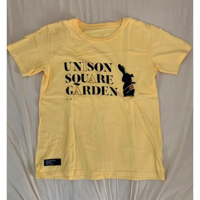 UNISON SQUARE GARDEN(ユニゾンスクエアガーデン)のUNISON SQUARE GARDEN ユニゾン 15周年 イエローTシャツ エンタメ/ホビーのタレントグッズ(ミュージシャン)の商品写真