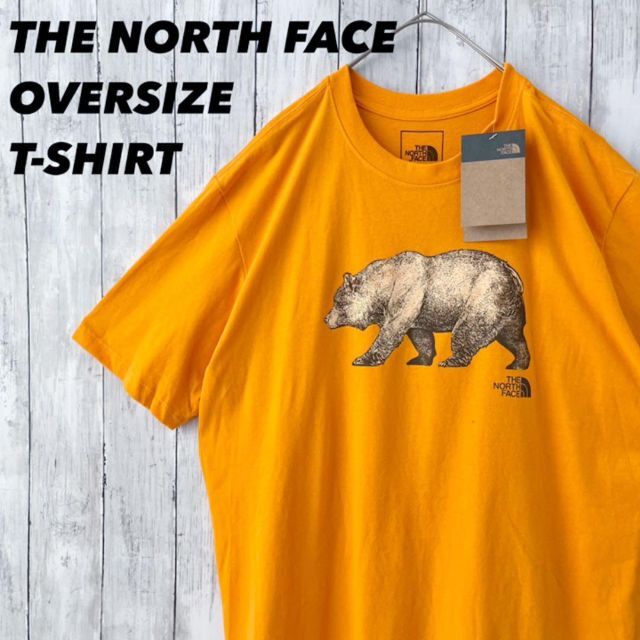 THE NORTH FACE(ザノースフェイス)の新品未使用品　海外企画　ノースフェイス熊ベアープリントTシャツ　XL オレンジ メンズのトップス(Tシャツ/カットソー(半袖/袖なし))の商品写真