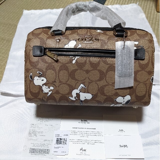 COACH(コーチ)のCOACH   ミニバッグ　シグネチャー　スヌーピー レディースのバッグ(ハンドバッグ)の商品写真