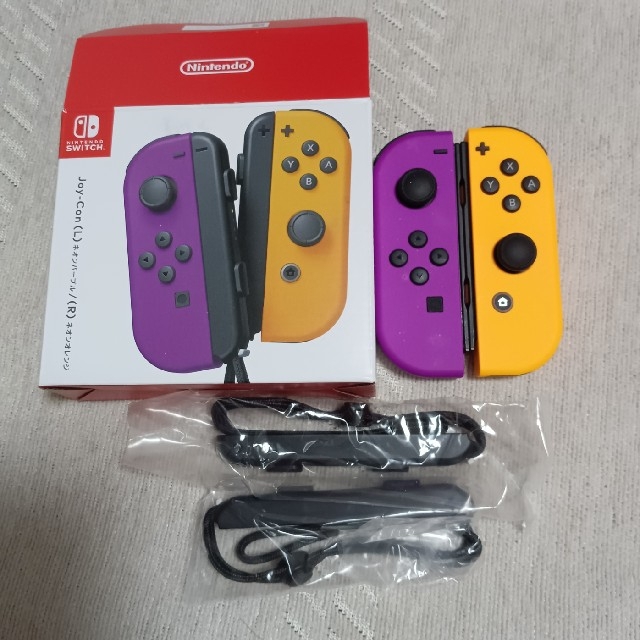 Nintendo Switch(ニンテンドースイッチ)のSwitch Joy-Con（ネオンパープル/ネオンオレンジ） エンタメ/ホビーのゲームソフト/ゲーム機本体(携帯用ゲーム機本体)の商品写真