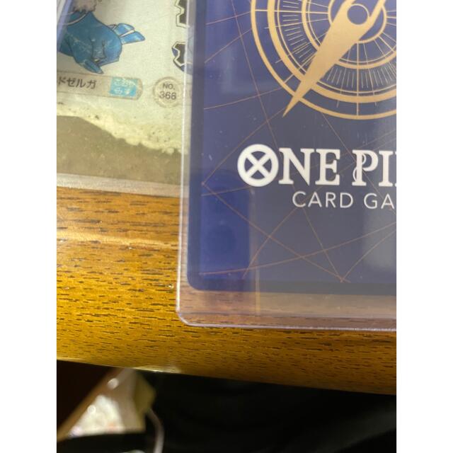 ONE PIECE(ワンピース)のワンピースカードゲーム　ドフラミンゴ　パラレル エンタメ/ホビーのトレーディングカード(シングルカード)の商品写真
