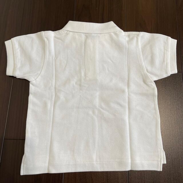 COMME des GARCONS(コムデギャルソン)の新品 タグ付 プレイコムデギャルソン キッズ ポロシャツ ホワイト 2 キッズ/ベビー/マタニティのキッズ服男の子用(90cm~)(Tシャツ/カットソー)の商品写真