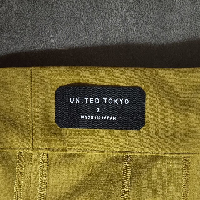 UNITED TOKYOアシメプリーツベルテッドパンツ
