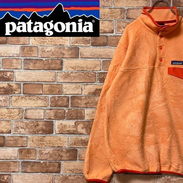 patagonia(パタゴニア)のパタゴニア　フリースジャケット　ハーフボタンオレンジ　アウトドア　古着女子　M. レディースのトップス(その他)の商品写真