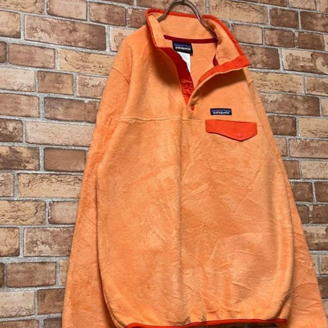 patagonia(パタゴニア)のパタゴニア　フリースジャケット　ハーフボタンオレンジ　アウトドア　古着女子　M. レディースのトップス(その他)の商品写真