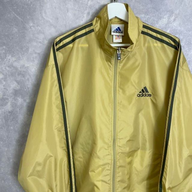 adidas(アディダス)のアディダス 90s ナイロンジャケット トラックジャケット マスタード イエロー メンズのトップス(ジャージ)の商品写真