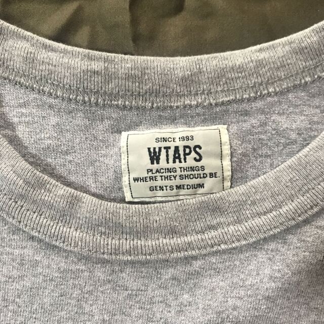 W)taps(ダブルタップス)のWTAPS DESIGN Tシャツ　グレー　Mサイズ メンズのトップス(Tシャツ/カットソー(半袖/袖なし))の商品写真