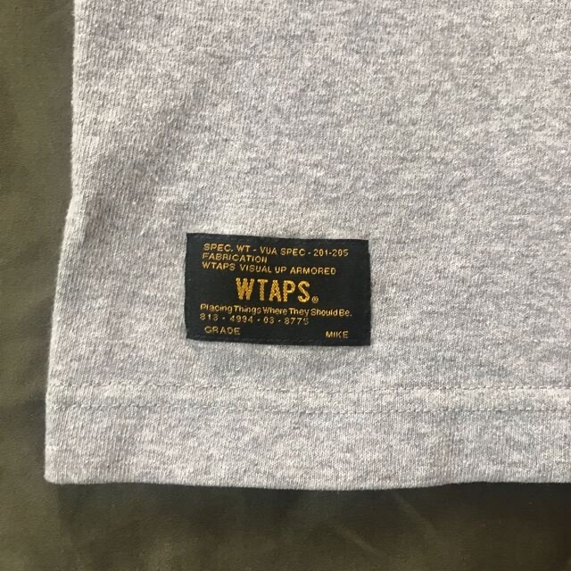 W)taps(ダブルタップス)のWTAPS DESIGN Tシャツ　グレー　Mサイズ メンズのトップス(Tシャツ/カットソー(半袖/袖なし))の商品写真