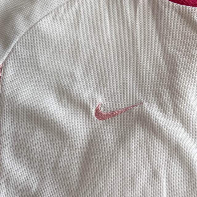 NIKE(ナイキ)のナイキ　スポーツTシャツ　白　ピンク　L スポーツ/アウトドアのランニング(ウェア)の商品写真