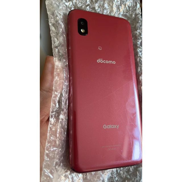 中古 docomo Galaxy A21 simフリー レッド　動作確認済み スマホ/家電/カメラのスマートフォン/携帯電話(スマートフォン本体)の商品写真