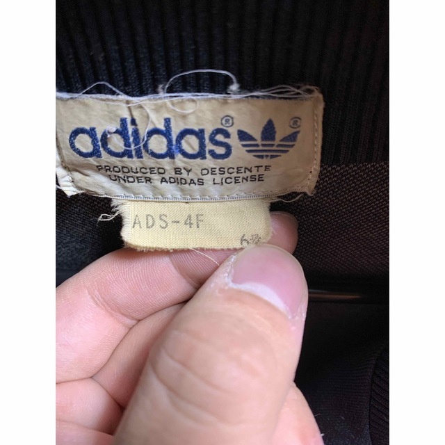 adidas(アディダス)のadidas デサント トラックジャケット 6号 黒 オレンジ メンズのトップス(ジャージ)の商品写真