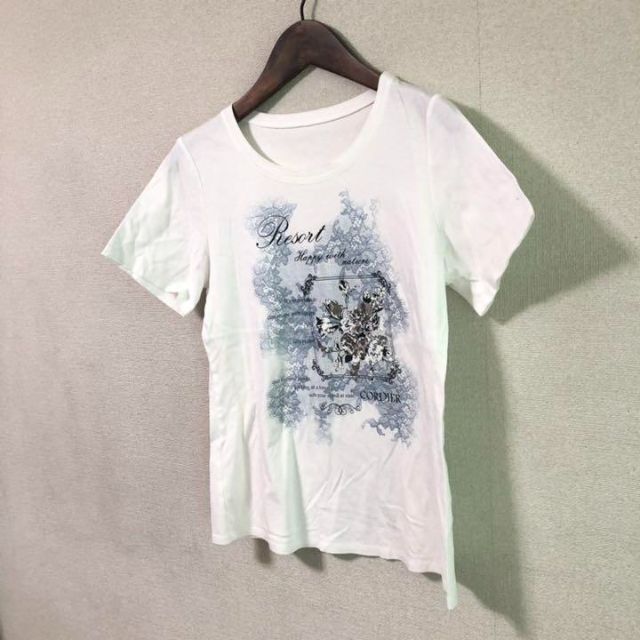 CORDIER(コルディア)の【しおちゃん様専用】美品 CORDIER 半袖　Tシャツ  デザイン柄　白　L レディースのトップス(Tシャツ(半袖/袖なし))の商品写真