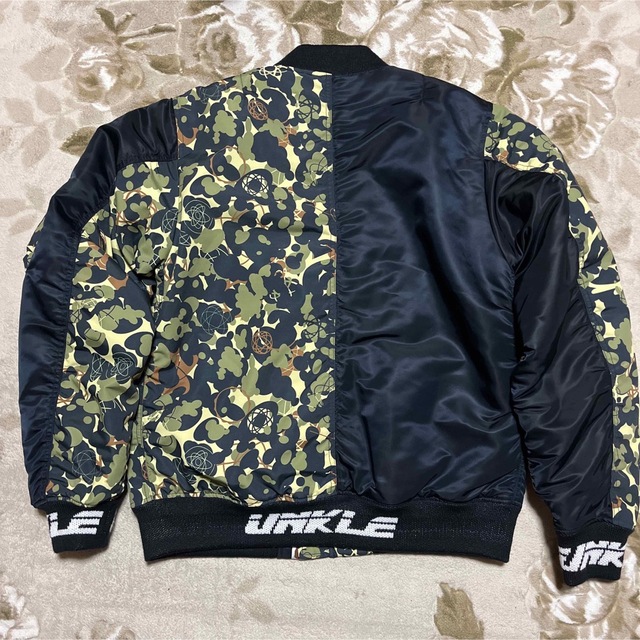 A BATHING APE(アベイシングエイプ)のAPE  BAPE  KAWS UNKLE MA-1 FUTURA ジャケット メンズのジャケット/アウター(ミリタリージャケット)の商品写真