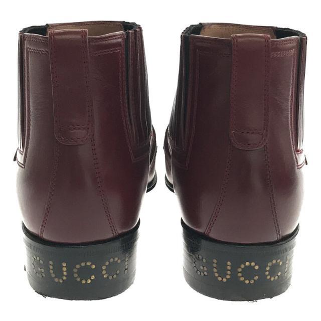 Gucci(グッチ)のGUCCI / グッチ | 2019AW | 572992 G Brogue Leather Side Gore Ankle Boots メダリオン ゴールド金具 ストラップ レザー アンクル ブーツ 保存袋・箱有 | 35 1/2 | バーガンディー | レディース レディースの靴/シューズ(ブーツ)の商品写真