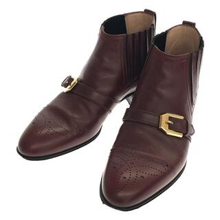 グッチ(Gucci)のGUCCI / グッチ | 2019AW | 572992 G Brogue Leather Side Gore Ankle Boots メダリオン ゴールド金具 ストラップ レザー アンクル ブーツ 保存袋・箱有 | 35 1/2 | バーガンディー | レディース(ブーツ)