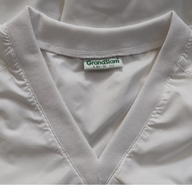 Munsingwear(マンシングウェア)のマンシングウェア　グランドスラムジャケット　白ウインドブレーカー中古品 スポーツ/アウトドアのゴルフ(ウエア)の商品写真