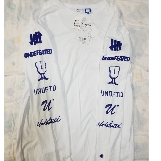 UNDEFEATED(アンディフィーテッド)のChampion×UNDEFEATED　チャンピオン×アンディフィーテッド メンズのトップス(Tシャツ/カットソー(七分/長袖))の商品写真