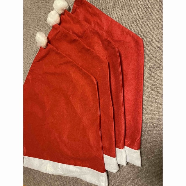 クリスマス　椅子カバー　４枚セット サンタクロース帽子　チェアーカバー パーティ インテリア/住まい/日用品の椅子/チェア(その他)の商品写真