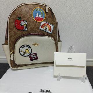 コーチ(COACH)のCOACH コーチ スヌーピー コラボ リュック ブラウン ワッペン(リュック/バックパック)