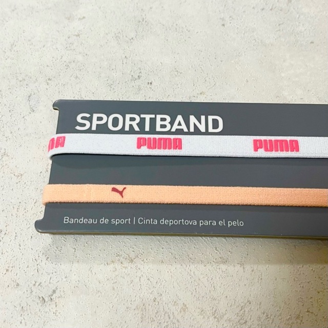 PUMA(プーマ)の新品・送料無料　PUMA 細いヘアバンド2本セット ホワイト　ライトオレンジ スポーツ/アウトドアのサッカー/フットサル(ウェア)の商品写真