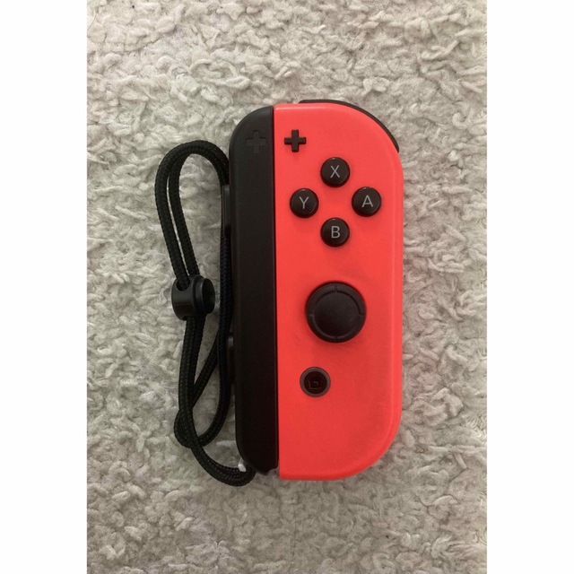 Nintendo Switch(ニンテンドースイッチ)の【Nintendo SWITCH】Joy-Con(R)ネオンレッド ジャンク品 エンタメ/ホビーのゲームソフト/ゲーム機本体(携帯用ゲーム機本体)の商品写真