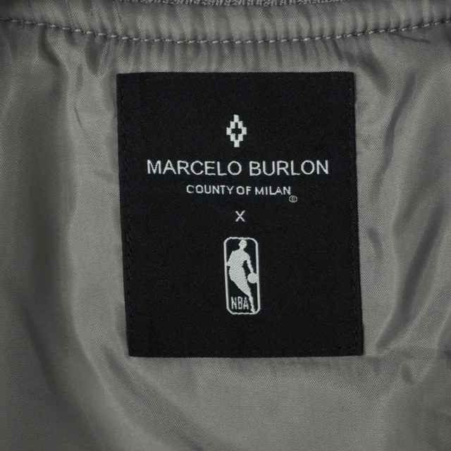 MARCELO BURLON(マルセロブロン)のマルセロバーロン マルセロブロン× エヌビーエー ジャケット S ライトグレー  メンズのジャケット/アウター(スタジャン)の商品写真