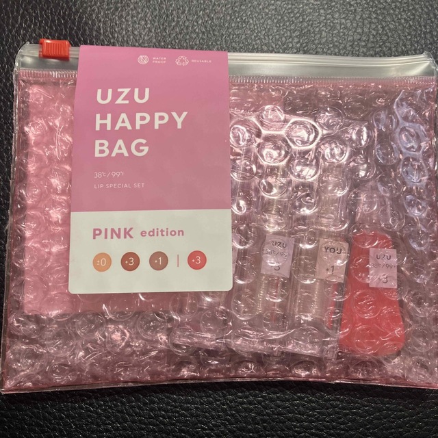 FLOWFUSHI(フローフシ)のUZU  HAPPY  BAG  ピンクエディション コスメ/美容のベースメイク/化粧品(リップグロス)の商品写真