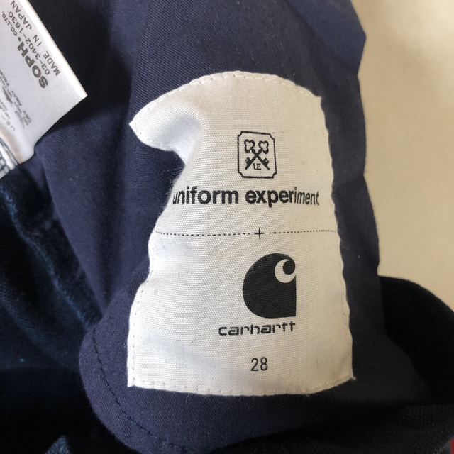 uniform experiment(ユニフォームエクスペリメント)のユニフォームエクスペリメント carhartt カーハート フラグメント メンズのパンツ(チノパン)の商品写真